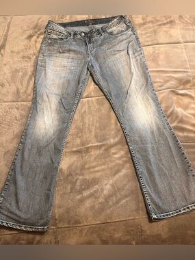 Woman’s silver jeans size 18
